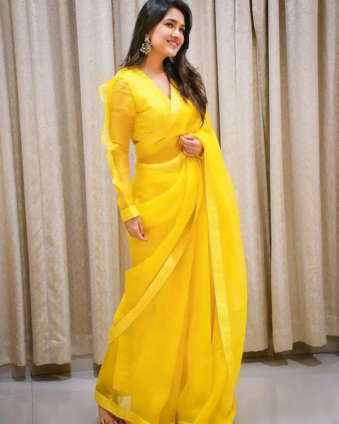 Beautiful Indian Model Vani Bhojan in yellow organza Saree